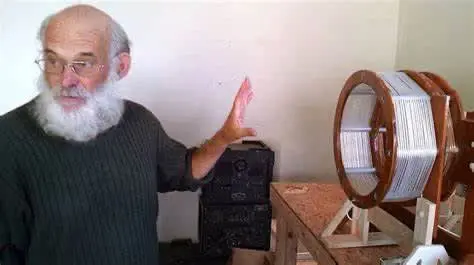 A person with a beard and a wheel Description automatically generated